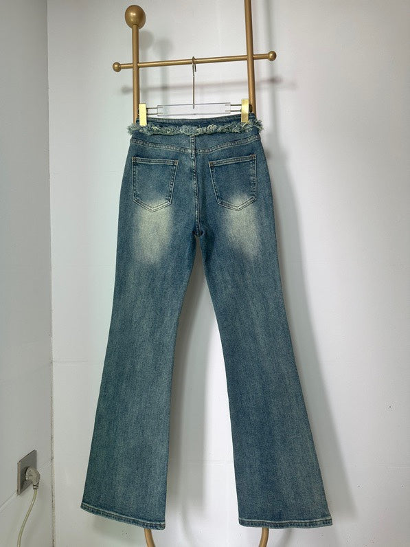 Raw-edge denim flared pants