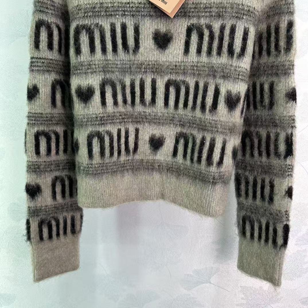 Contrasting stripes and heart letters sweater