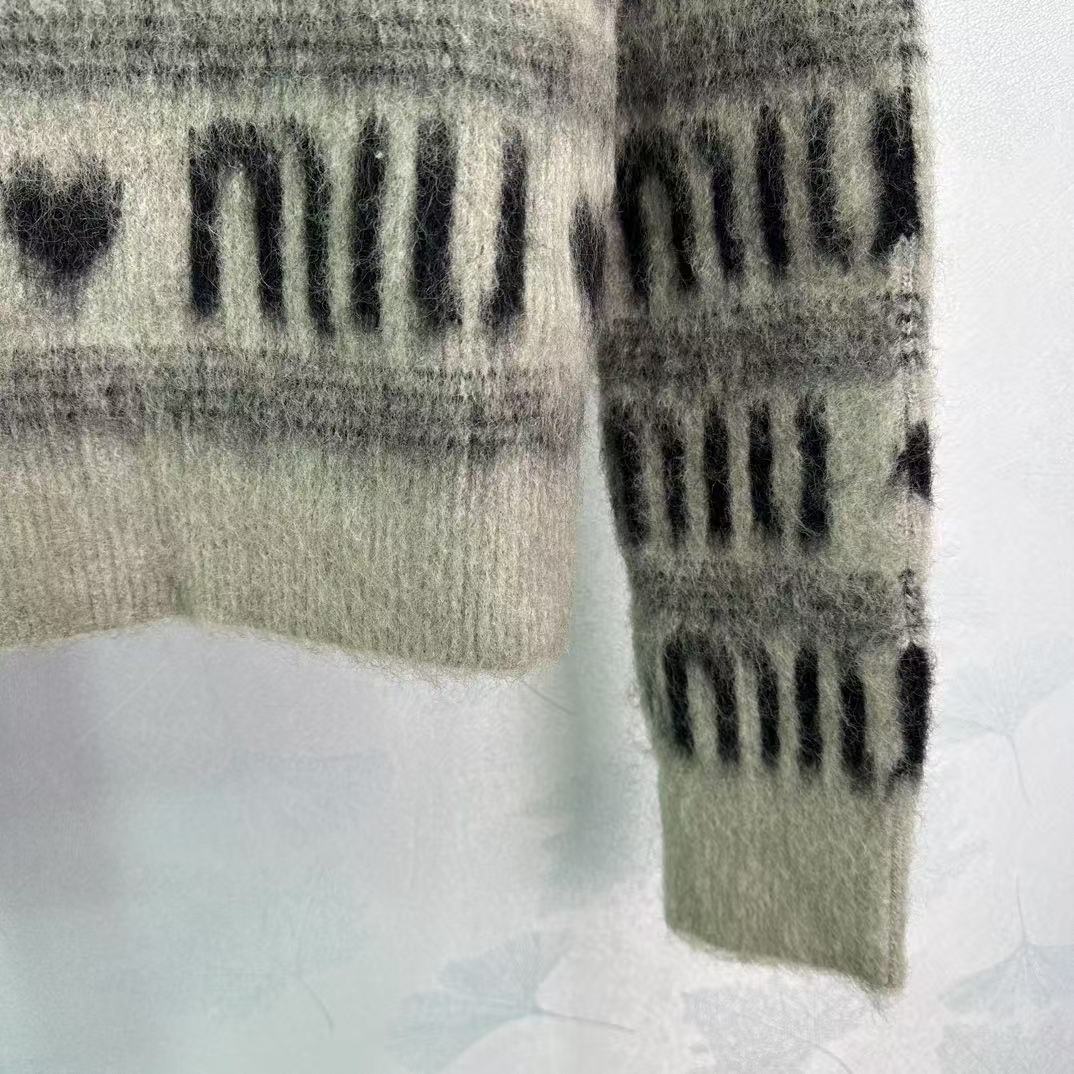 Contrasting stripes and heart letters sweater