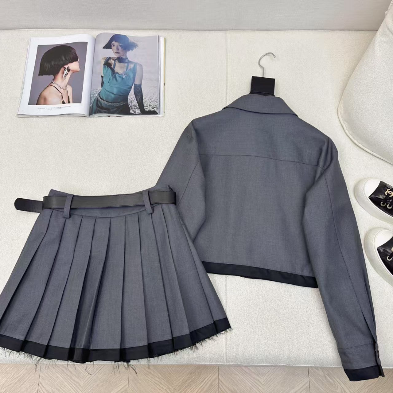 Spliced lapel jacket and belted pleated skirt suit