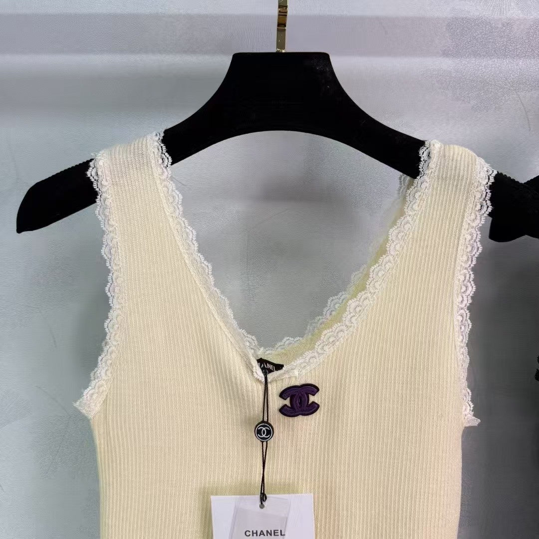 Knitted vest with lace collar and cuffs