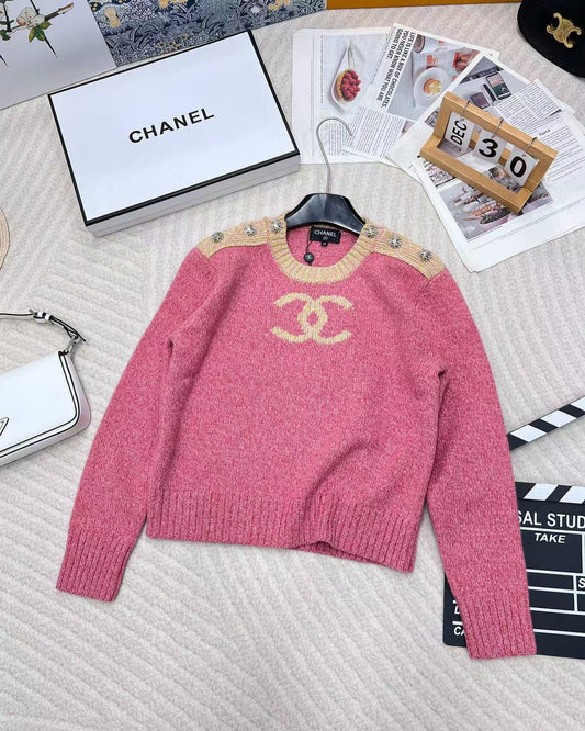 Pink jacquard knit long sleeves with dropped shoulders and button detail