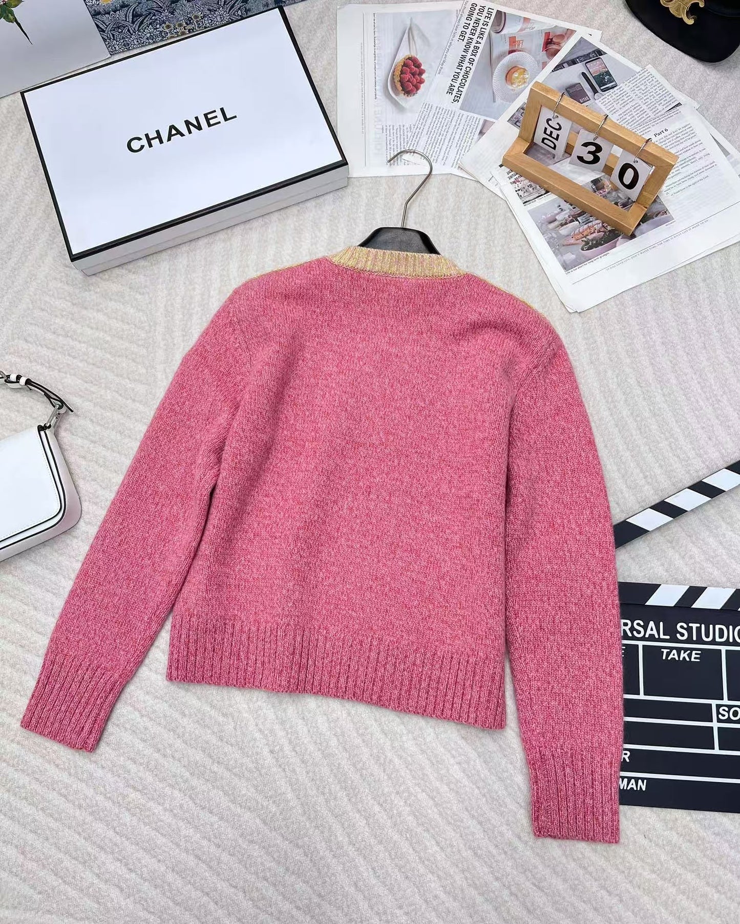 Pink jacquard knit long sleeves with dropped shoulders and button detail