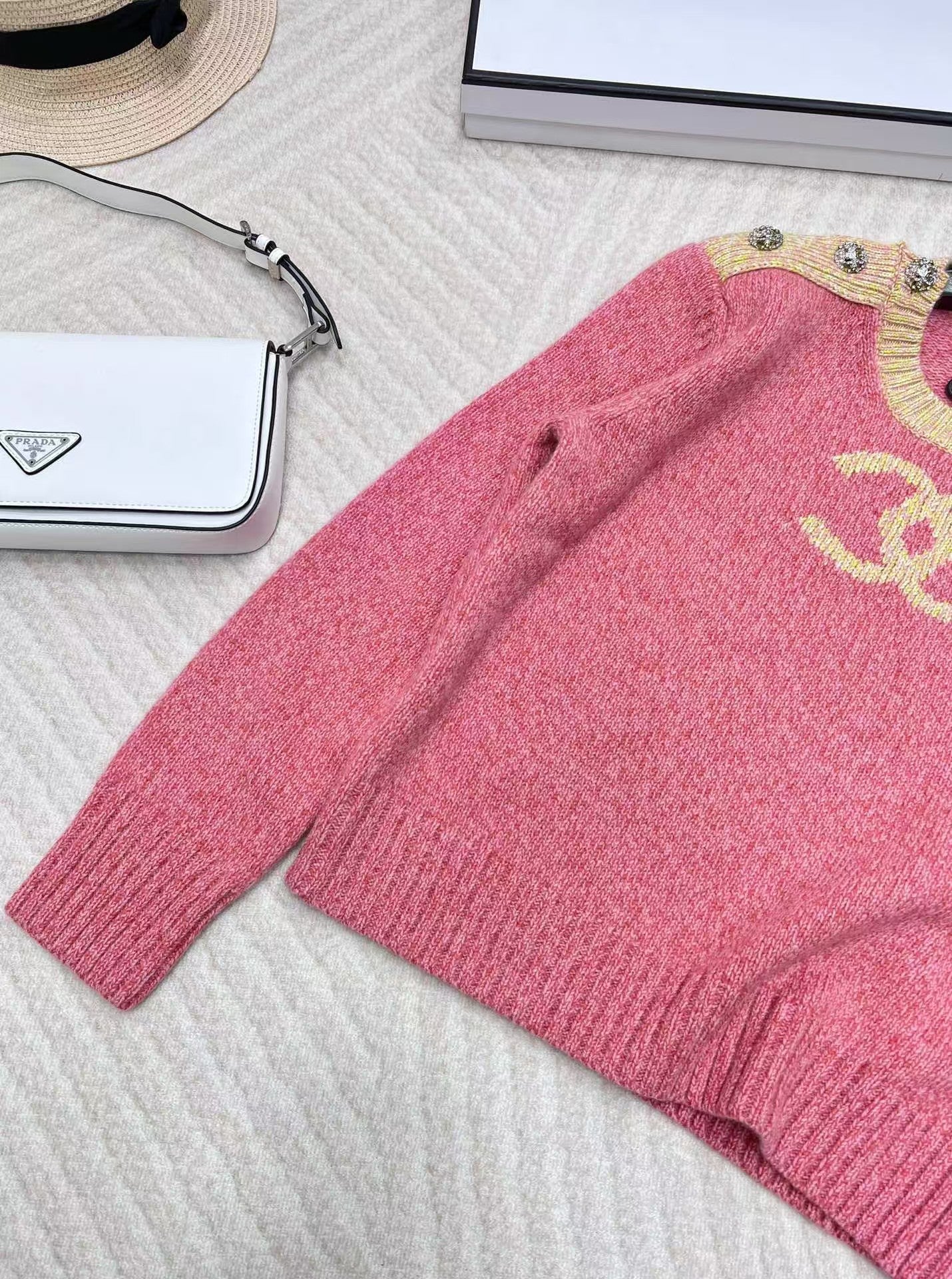 Pink jacquard knit long sleeves with dropped shoulders and button detail